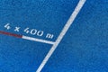 Close up of 400 meter sprint blue tracking field