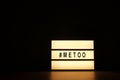 Close up of ` METOO` text in lightbox. Female empowering educational movement.