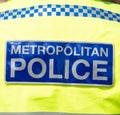 Close up of Metropolitan Police sign on jacket.
