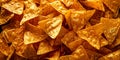 Close up of mexican triangle tortilla nacho cheese chips.