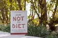 Michael Greger\'s How Not To Diet book in the garden. Diet book.