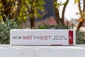 Michael Greger\'s How Not To Diet book in the garden. Diet book.