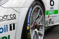 Close up of Michelin slick racing tire on Porsche Carrera car, front view motorsport Royalty Free Stock Photo