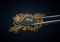 Close-up of a microchip being handled with precision tweezers