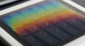 Close-up of a Microchip Wafer with Rainbow Interference Pattern Royalty Free Stock Photo