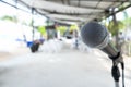 Close up Microphone on abstract blurred background of speech seminar, meeting, event in outdoor restaurant. Royalty Free Stock Photo