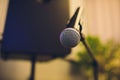 Close up of microphone in concert hall or conference room. Royalty Free Stock Photo