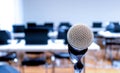 Close up microphone with laptop on table background in seminar room Royalty Free Stock Photo