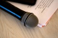 Close up microphone with paper notecards. Concept of speaker preparation to speak