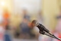 Close-up of microphone on stage for speaker speech with blur bokeh light background Royalty Free Stock Photo
