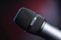 Close-up of microphone in studio or concert performance on stage, on black background Royalty Free Stock Photo