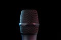 Close-up of microphone in studio or concert performance on stage, on black background Royalty Free Stock Photo