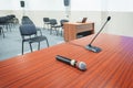 Close up Microphone on the table, concept of speaker or teacher preparation to speak in seminar class room