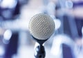 Close up microphone with tripod on stage in seminar room Royalty Free Stock Photo