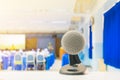 Close up microphone wireless Stand on white table in business conference interior seminar meeting room and Background blur Royalty Free Stock Photo