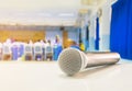 Close up microphone wireless Stand on white table in business conference interior seminar meeting room and Background blur Royalty Free Stock Photo