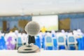 Close up microphone wireless Stand on white table in business conference interior seminar meeting room Royalty Free Stock Photo