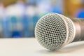 Close up microphone wireless on the white table in business conference interior seminar meeting room Royalty Free Stock Photo