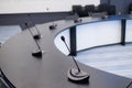 Close-up of microphones in an empty meeting room at a press conference. Royalty Free Stock Photo