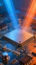 Close-up of a microprocessor on a circuit board illuminated by blue and orange light beams highlighting advanced technology and Royalty Free Stock Photo