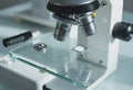 Close-up of microscope eyepiece and adjustment controls for precise viewing Royalty Free Stock Photo