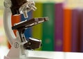 Close up Microscope on table with laboratory equipment in chemical lab