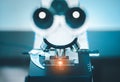 Close up of microscope with test sample in medical research lab or science laboratory Royalty Free Stock Photo