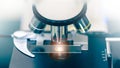 Close up of microscope with test sample in medical research lab or science laboratory Royalty Free Stock Photo