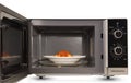 Close up microwave oven is warm chicken spaghetti. Royalty Free Stock Photo