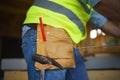 Close-up of mid section construction worker in protective clothes and his working tools . Royalty Free Stock Photo