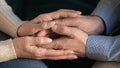 Close up aged wife holding husband hands, showing support, love