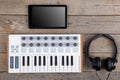 Close up of MIDI controller volume fader, knob and keys Royalty Free Stock Photo