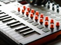 Close-up. MIDI keyboard. Modern musical equipment for recording studio, music studio. Sound work, podcast. Workplace of a sound Royalty Free Stock Photo