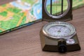 Close-up of a military compass on a map of Russia. Determining the direction of the compass Royalty Free Stock Photo