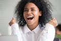 Young black woman scream yes reading good news online Royalty Free Stock Photo