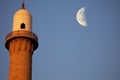 close up of minaret with crescent moon in background