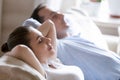 Close up of calm couple relaxing on cozy couch Royalty Free Stock Photo