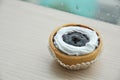 Close up mini blueberry tart on wood background