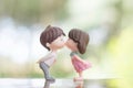 mini couple dolls in romantic kiss for Valentine& x27;s day concept