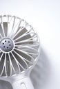 Close-up of mini electric fan with handle  on white background Royalty Free Stock Photo