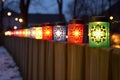 close-up of mini lantern christmas lights on a wooden fence Royalty Free Stock Photo