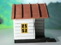a close up of a miniature figure of a house seen from one side.