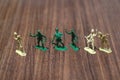 Close-up of miniature a group of plastic toys soldiers at war. Royalty Free Stock Photo
