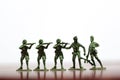 Close-up of miniature a group of plastic toys soldiers at war. Royalty Free Stock Photo