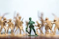 Close-up of miniature a group of plastic toys soldiers at war.