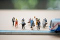 Miniature people waiting train at early morning rush hours. Thai public transportation concept Royalty Free Stock Photo