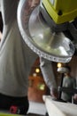 a close-up of a miter saw in use for cutting a piece of wood Royalty Free Stock Photo