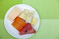 Mixed fruit plate on wooden table Royalty Free Stock Photo