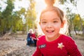 Close-up Mixed Race Baby Girl Christmas Portrait With Family Behind