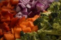 A close up of mixed vegetables being prepared in a kitchen